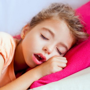 Deep sleeping children girl closeup portrait