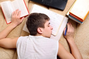 Teenager sleeps on the Books
