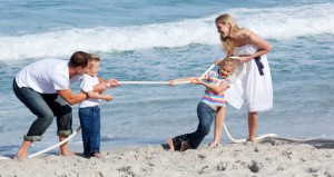 Lively family playing tug of war