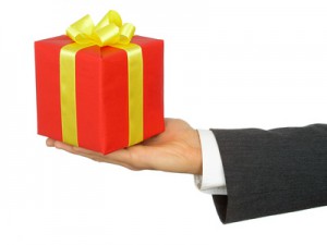 businessman holding gift